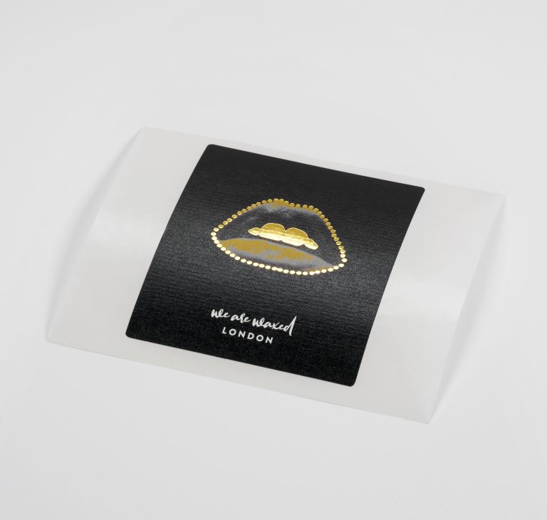 Candle label printed on black kraft paper with digitally applied foil